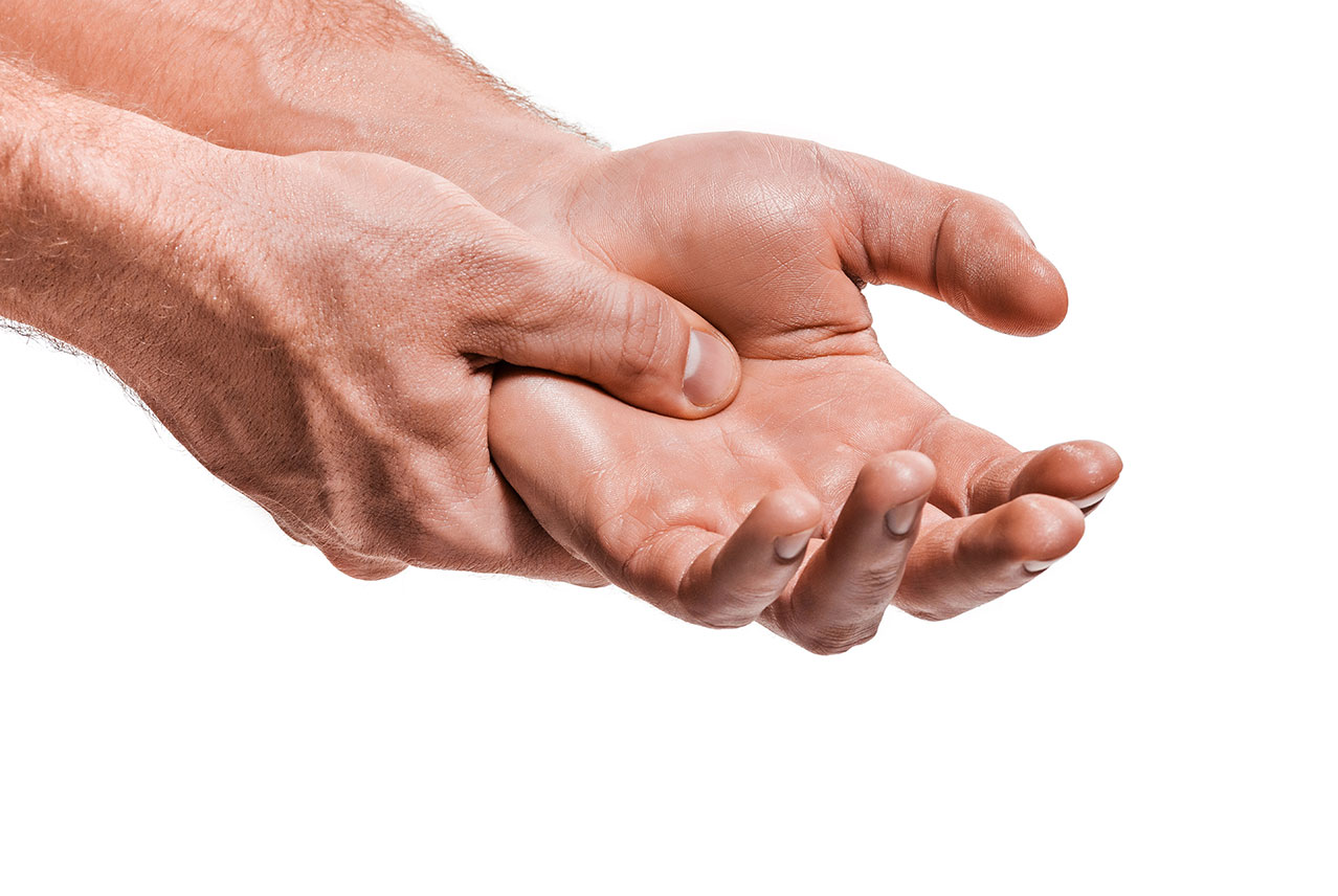 Male hands massaging pain points